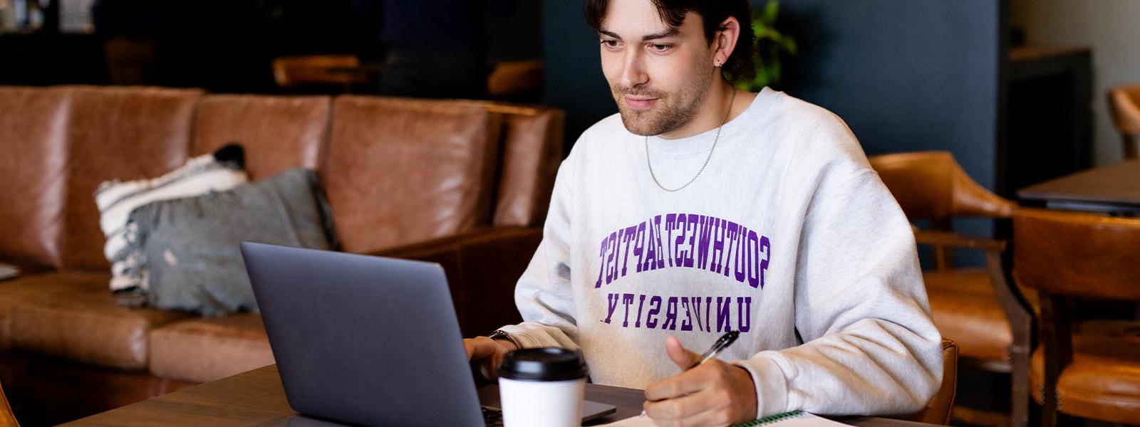 male businessperson sitting at desk